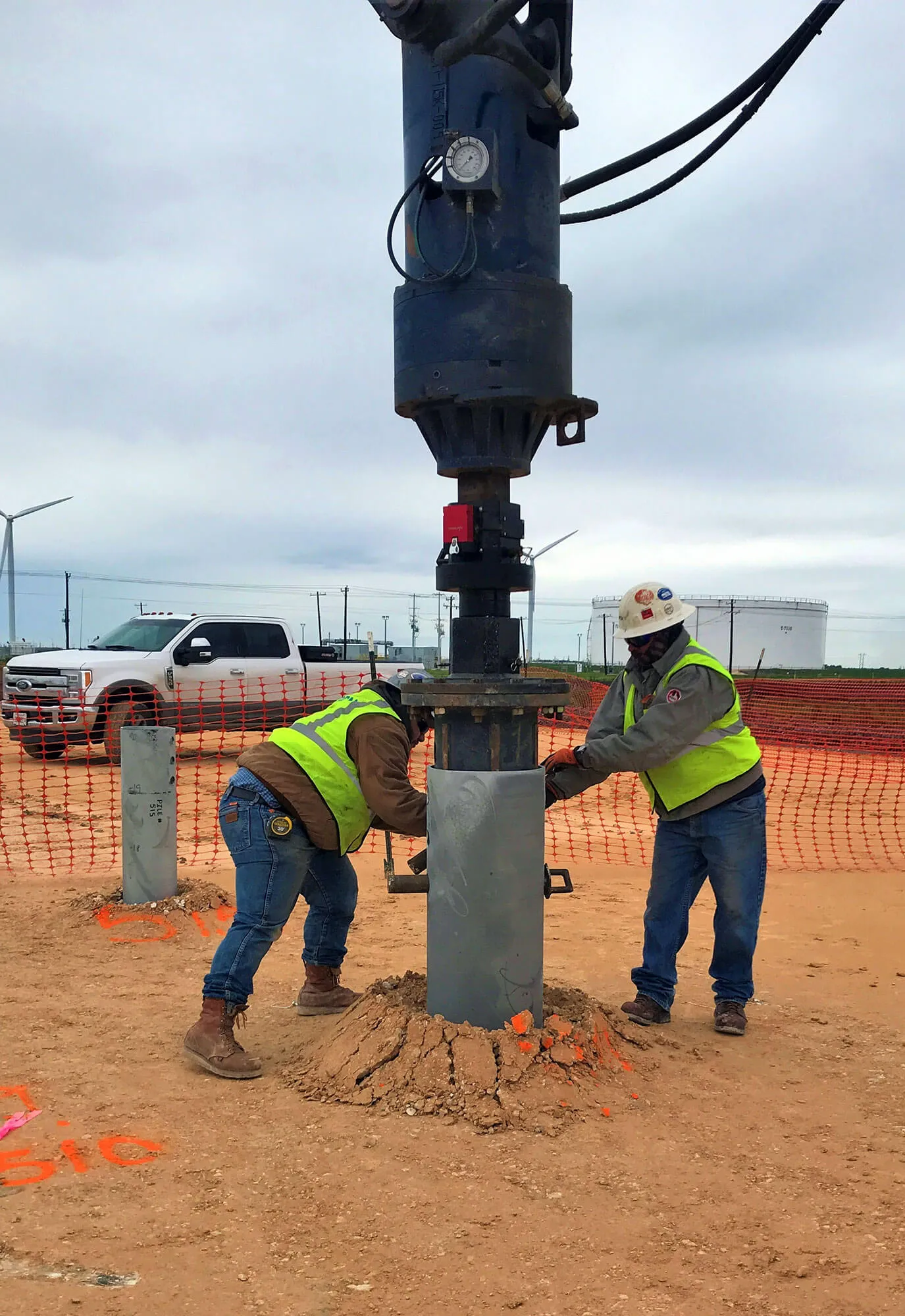 Helical pile being installed